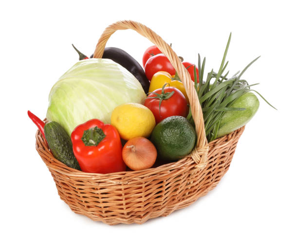 istock Fresh ripe vegetables and fruit in wicker basket on white background 1449329177