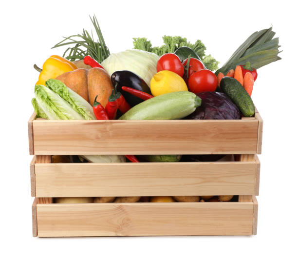 istock Fresh ripe vegetables and fruit in wooden crate on white background 1449329242
