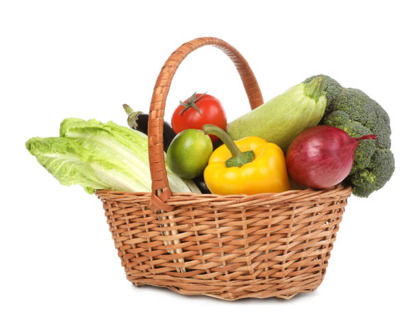 istock Fresh ripe vegetables and fruit in wicker basket on white background 1449329765