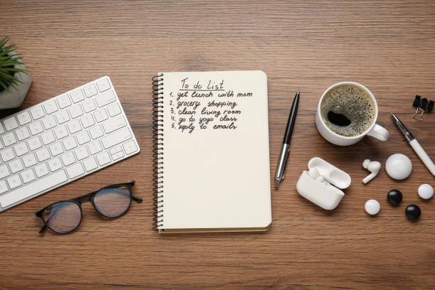 istock Flat lay composition with to do list on wooden table 1449334109