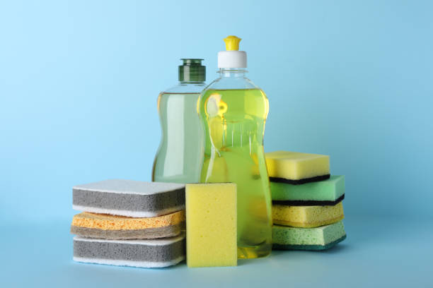 istock Sponges and other cleaning products on light blue background 1449334872