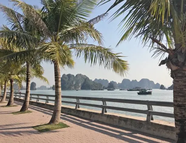 Walking along the waterfront boardwalk in Hạ Long, Vietnam.