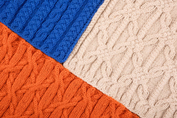istock Knitted blue orange and beige background 1449335929