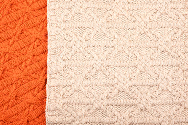 istock Knitted orange and beige background 1449335967