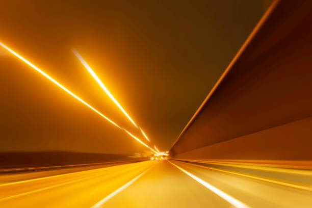 istock abstract blurred background of highway at night 1449342488