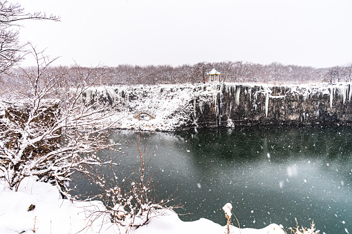 The pool under Diaoshuilou Waterfall will never froze due to underground volcanic heat, while the waterfall itself is always frozen in winter. The waterfall is a part of Jingpo Lake in Heilongjiang province, China.