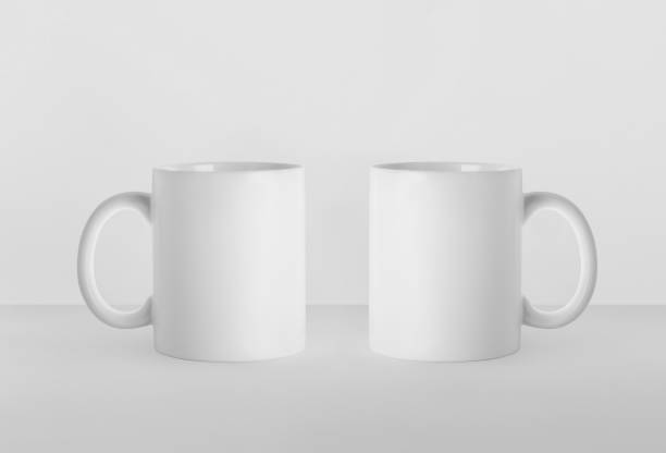 istock Blank ceramic mugs on white background. Mockup for design 1449346570