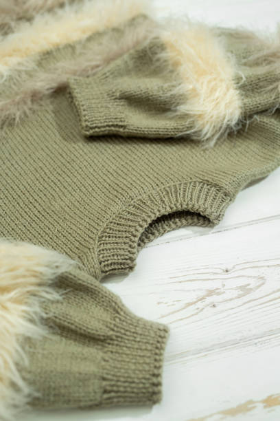 istock Knitted children's sweater on a white background 1449348000