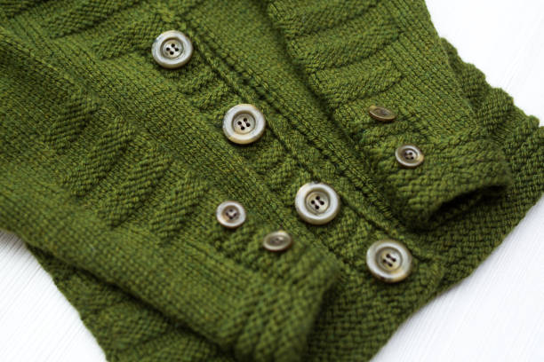 istock Knitted children's sweater on a white background 1449348102