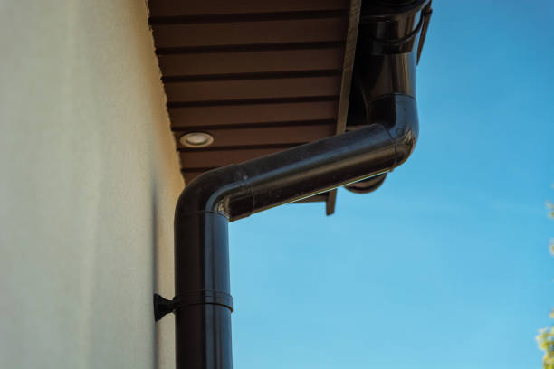 istock PVC gutter attached to the facade under the roof 1449349282