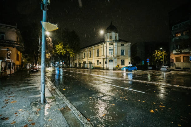 View of a wet city streets on a rainy night downtown.