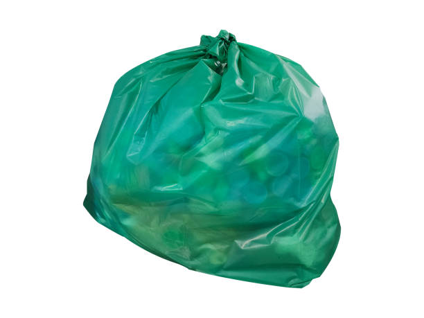 Green garbage bag isolated on white background.