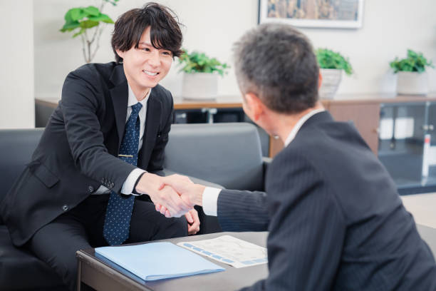 istock Businessmen shaking hands at a B2B business meeting 1449351234