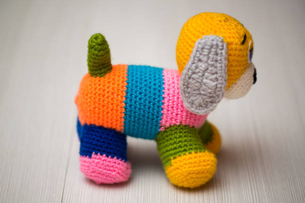 istock Knitted dog hand. Symbol 2018. 1449352069