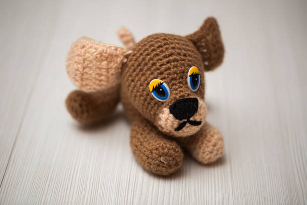 istock Knitted dog hand. Symbol 2018. 1449352556