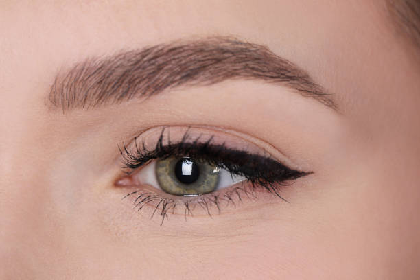 istock Young woman before permanent makeup procedure, closeup 1449353789