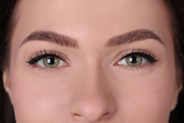 istock Young woman after permanent makeup procedure, closeup 1449354945