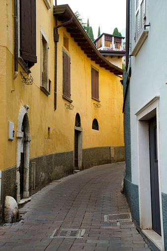 Toscolano Maderno, Italy - July 12, 2022: Old street at Toscolano Maderno, in Brescia province, Lombardy, Italy, on the Garda lake