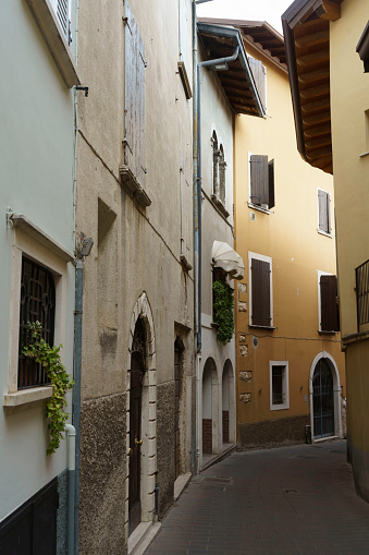 Toscolano Maderno, Italy - July 12, 2022: Old street at Toscolano Maderno, in Brescia province, Lombardy, Italy, on the Garda lake