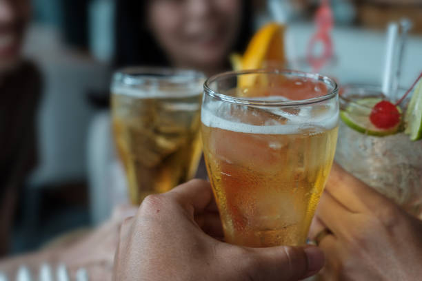 istock People are holding alcohol glass for drinking celebrate. 1449364219