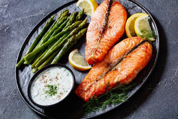 istock roast salmon steaks with asparagus and dill sauce 1449367831