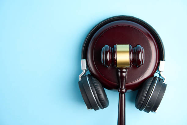 istock Headphones and judge gavel background with copy-space 1449367837
