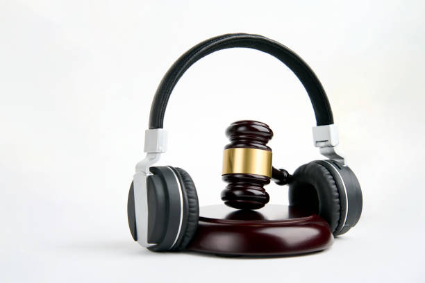 istock Headphones and judge gavel background with copy-space 1449367838