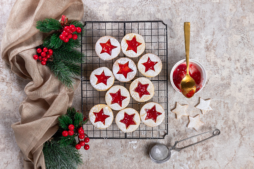 Linz cookies with jam in Christmas decorations, traditional cookies Austria, top view
