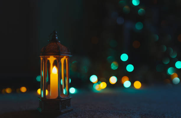 istock Arabic Lantern on black marble with blurry bokeh light background.Eid decorative traditional lamps illuminated ready for the Holy season of Ramadan Kareem.Concept for Islamic muslim holidays celebrate 1449369412