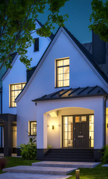 istock 3d rendering of white and black modern Tudor house in night 1449371185