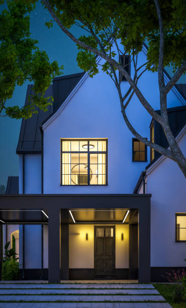 istock 3d rendering of white and black modern Tudor house in night 1449371186