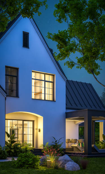 istock 3d rendering of white and black modern Tudor house in night 1449371280