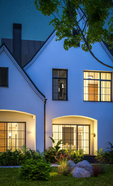 istock 3d rendering of white and black modern Tudor house in night 1449371283