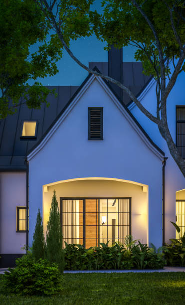 istock 3d rendering of white and black modern Tudor house in night 1449371302