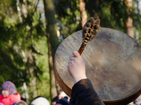 playing the big tambourine on a holiday. High quality photo