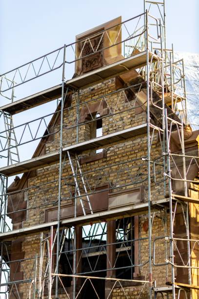 istock Vertical shot of an old masonry building covered in scaffolding 1449377183