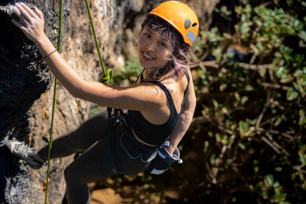 istock A young climber hanging on to a cliff by climbing rope 1449379156
