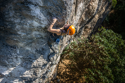 A talented female climber challenging one of the hardest route in the southern Taiwan.