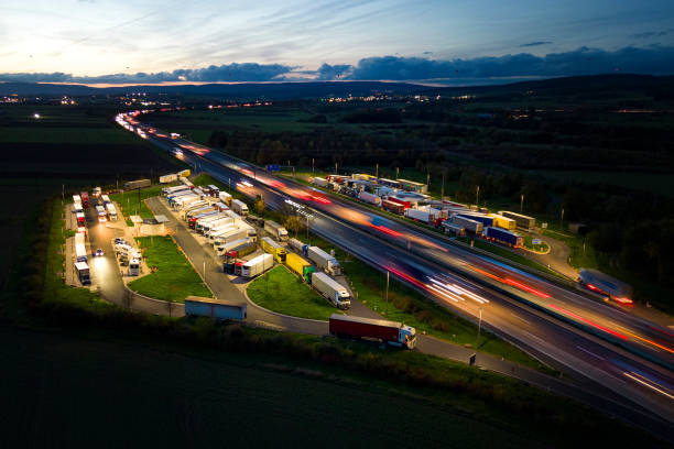 Highway and rest area at dusk - aerial view