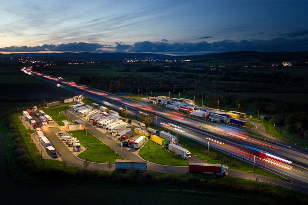 istock Highway and rest area at dusk - aerial view 1449380921