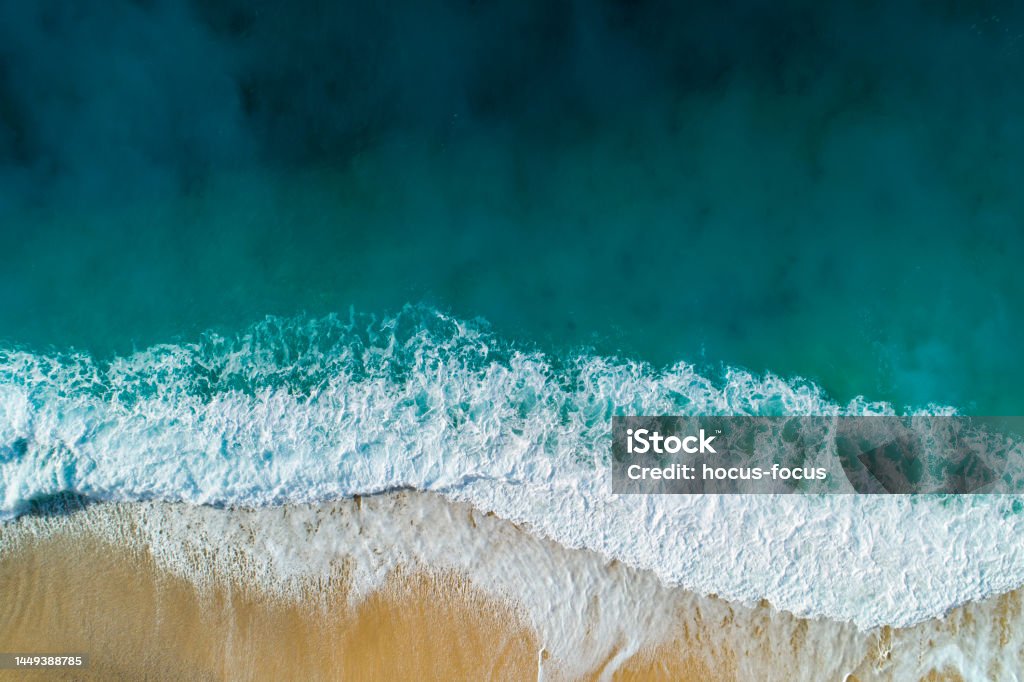 Aerial view of clear turquoise sea and waves Drone shot of sea, waves and and sandy beach of Kaputaş. Sea Stock Photo
