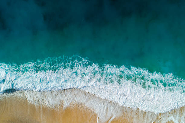 Aerial view of clear turquoise sea and waves Drone shot of sea, waves and and sandy beach of Kaputaş. aircraft point of view stock pictures, royalty-free photos & images