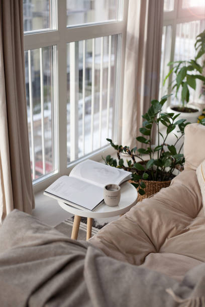 istock A cozy place to relax in a Scandinavian interior with a sofa, table, and magazine 1449392870