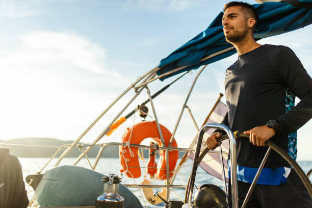 istock Young man sailing alone in autumn 1449392874