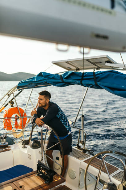 istock Young man sailing alone in autumn 1449392930
