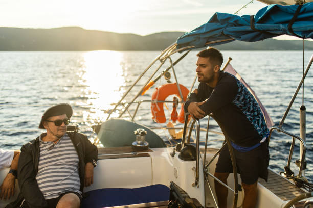 istock Father and son sailing on a sailboat 1449392937