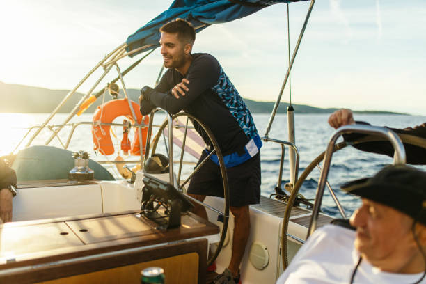 istock Father and son sailing on a sailboat 1449392941