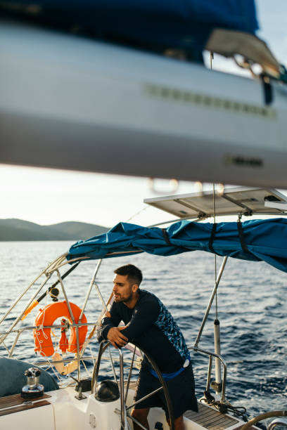 istock Young man sailing alone in autumn 1449392944