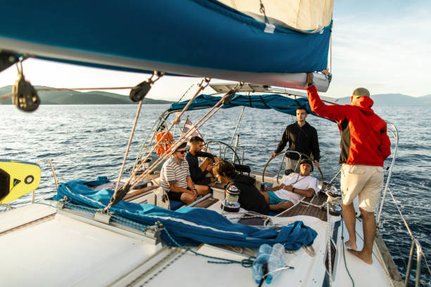 istock Group of men sailing on a sailboat 1449392995