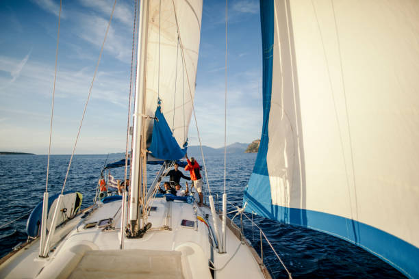 istock Group of men sailing on a sailboat 1449393001